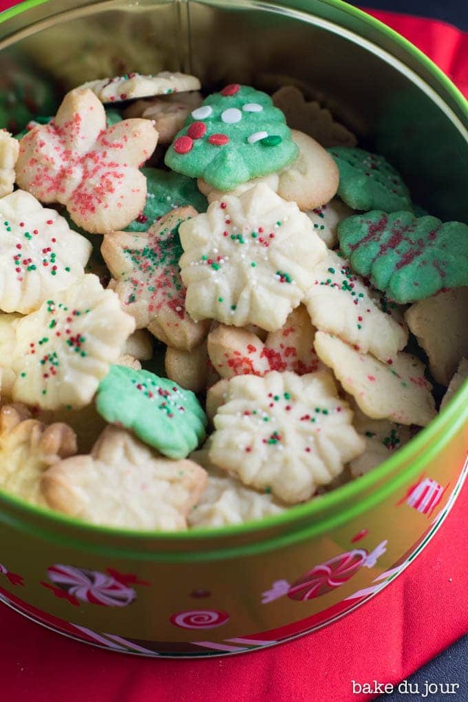 Holiday Spritz Cookies in the cookie tin