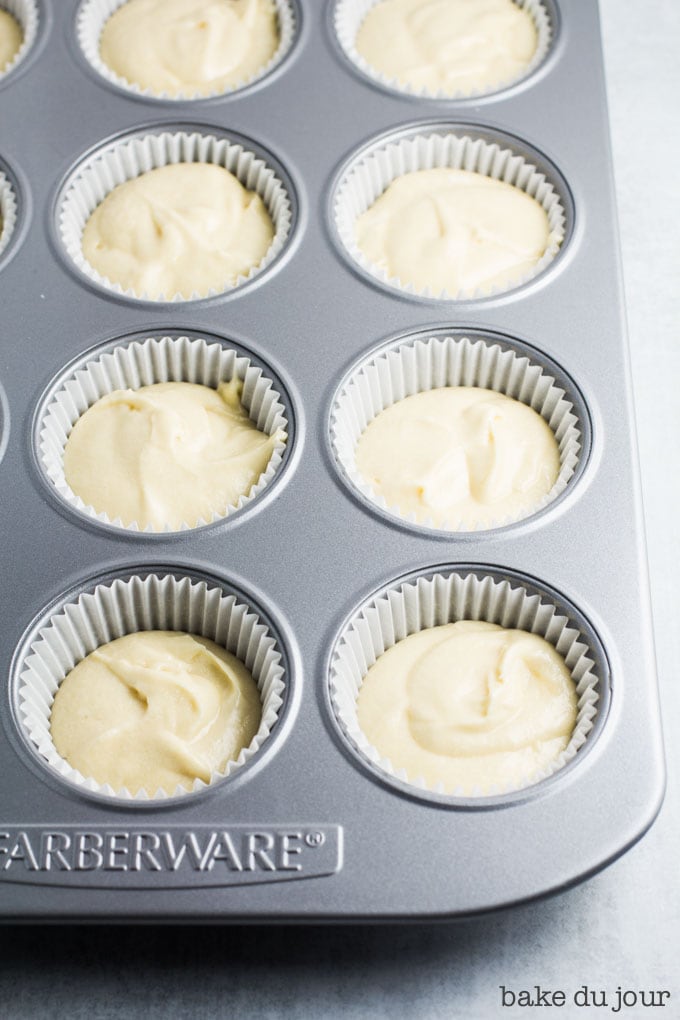 My silver muffin pan lined with white cupcake liners and filled 2/3 of the way with cupcake batter