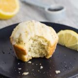 A Lemon Poppy Seed Muffin with a bite taken out of it