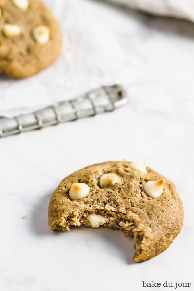 A White Chocolate Chai Cookie with a bite taken out of it