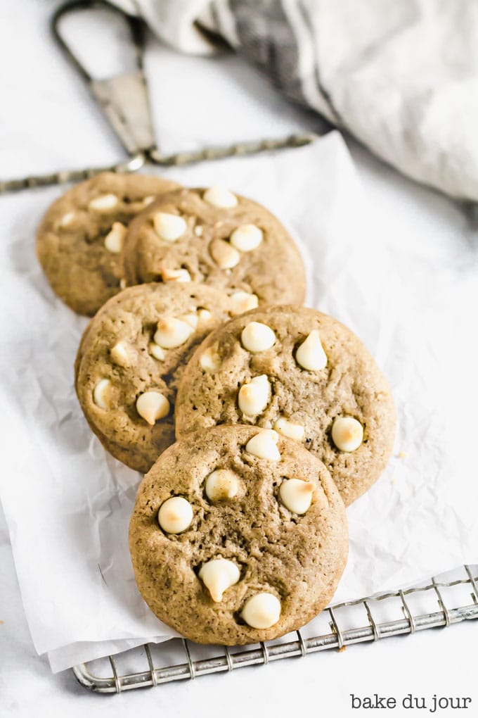 5 White Chocolate Chai Cookies layered on top of each other on cooling rack